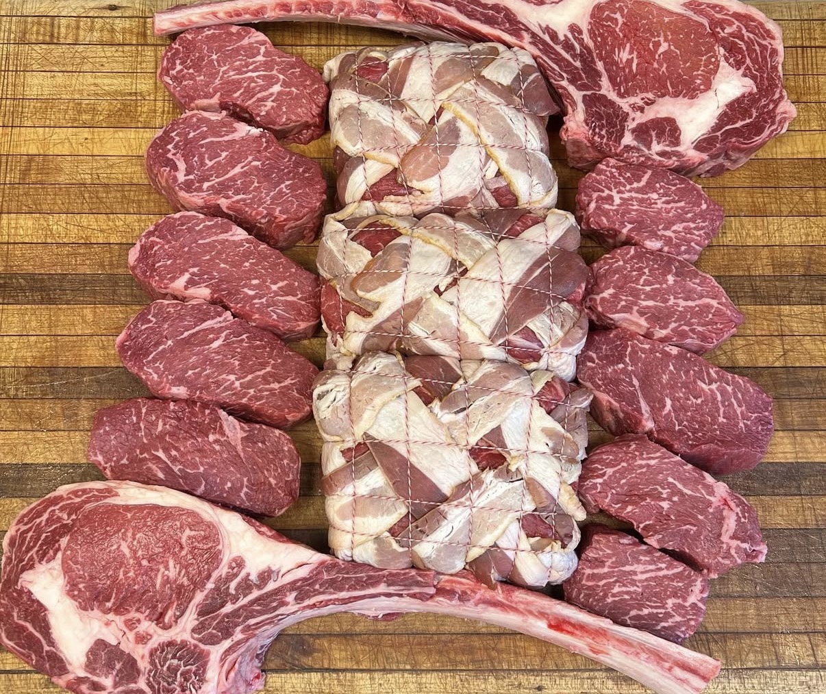 Selection of prime cuts including rib steaks and lamb chops at Peconic Prime Meats