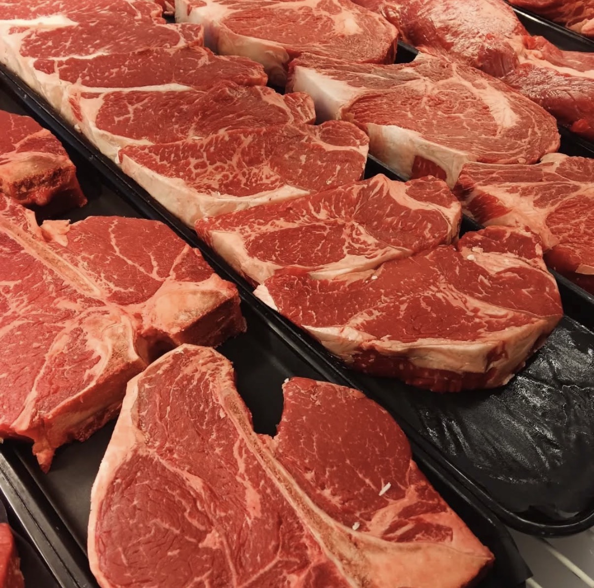 Premium USDA Prime steaks in the display case at Peconic Prime Meats Southampton